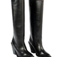 Pair of black knee-high boots on a white background