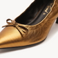 Dorada Pointed Pump Heel – Gold, close-up
