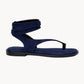Navy blue sandal with a strap on a white background