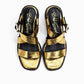 Pair of gold and black sandals