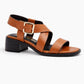 Brown sandal with a black block heel on a white background