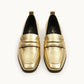Pair of gold loafers 