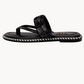 Black sandal with fur strap on a white background